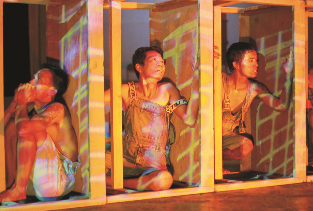 Prisoners crouched between tables placed upright to represent cells - Ad Akbar and M. Firdaus 2Stenberg